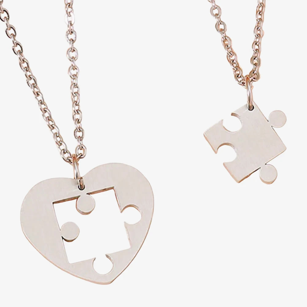 Collier pour couple puzzle en argent, cœur découpé et pièce de puzzle complémentaire
