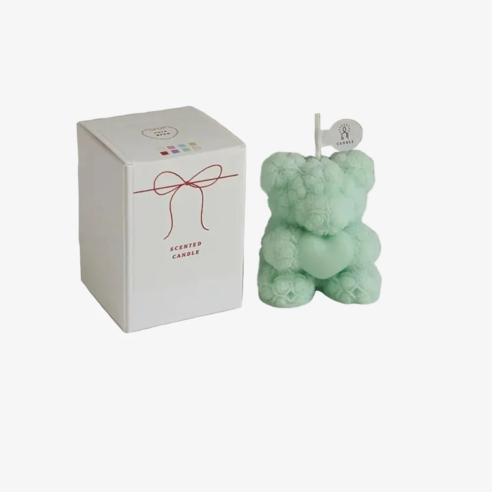 Rosy, c'est le ourson fleuri vert mint avec son packaging. 