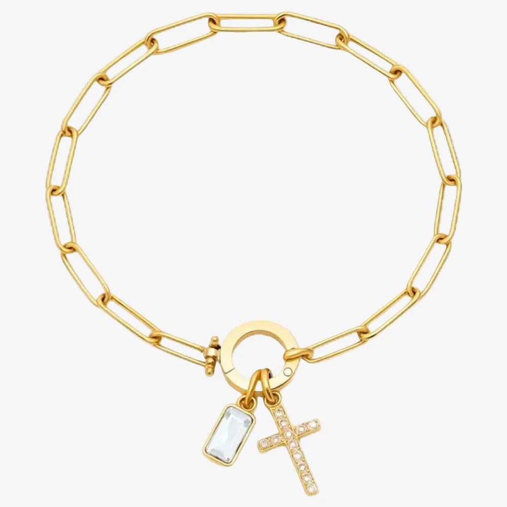 Bracelet pierre de naissance avril et une croix chrétienne sur un fond neutre