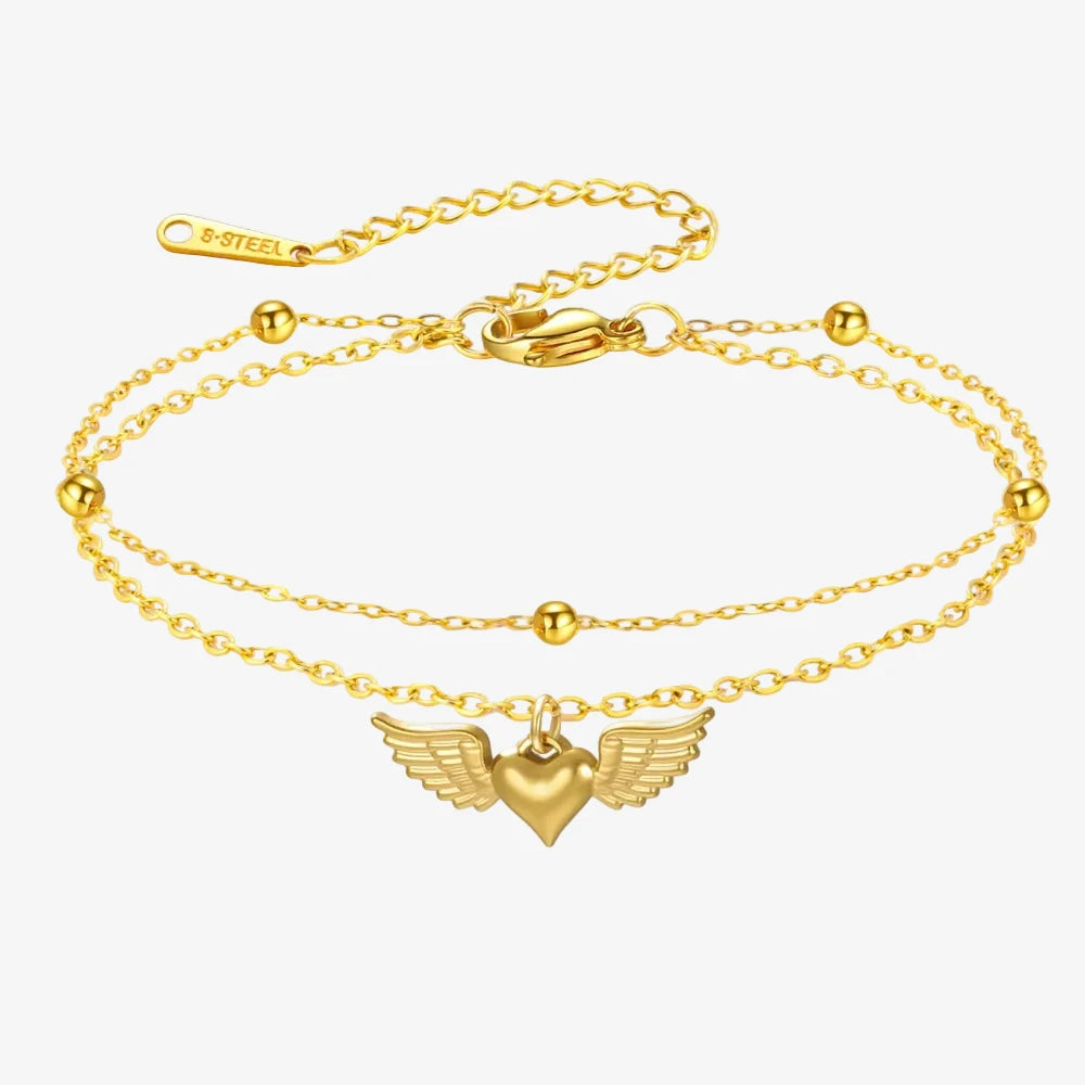 Bracelet chaine fine en or avec un coeur volant