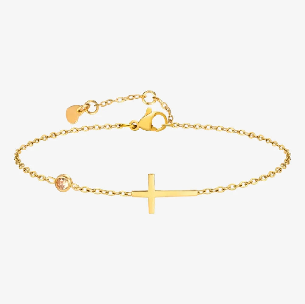 Pierre de naissance au mois de juin, sur un bracelet avec une croix sur un fond de 