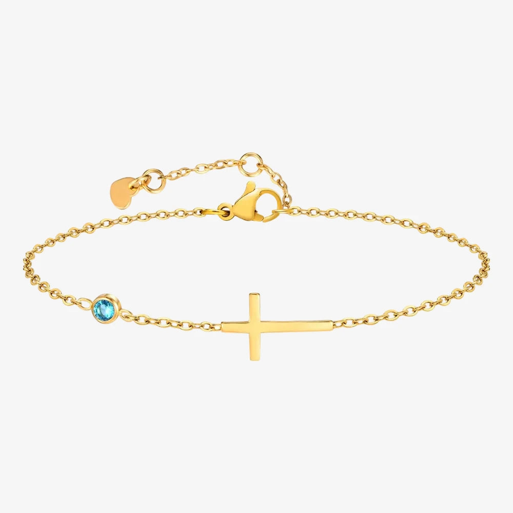 Pierre de naissance mars sur un bracelet avec une croix sur un fond neutre 