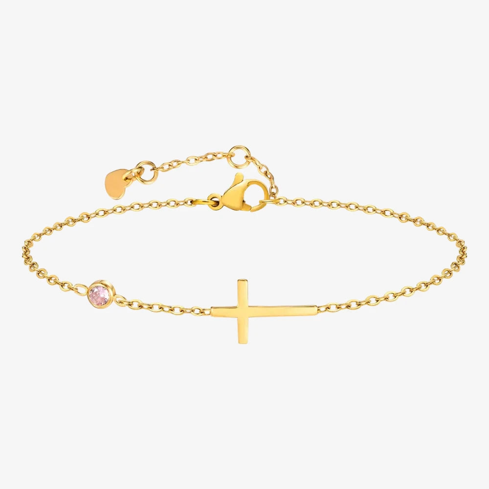 Bracelet Pierre de Naissance Octobre, chaîne avec une croix sur un fond neutre 