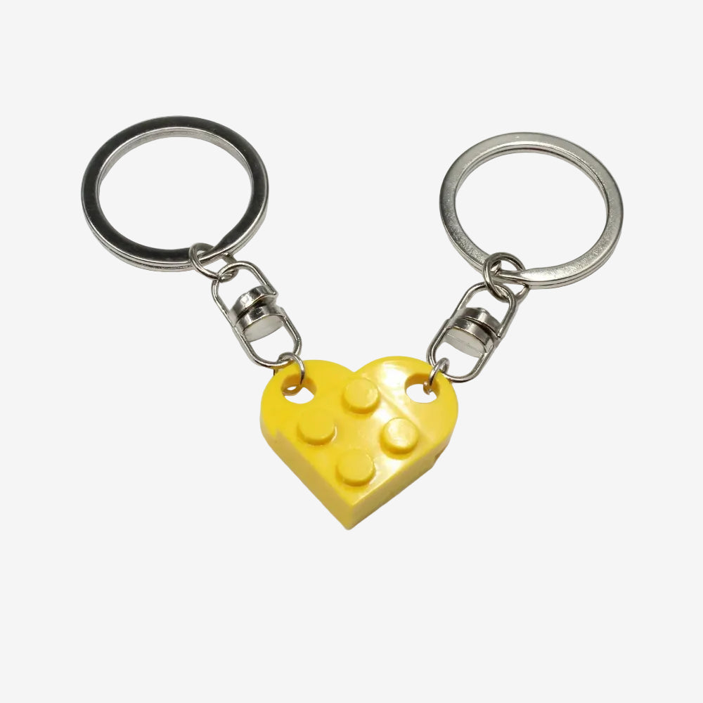 Deux porte clés jaune qui forme un coeur en pièce type Lego